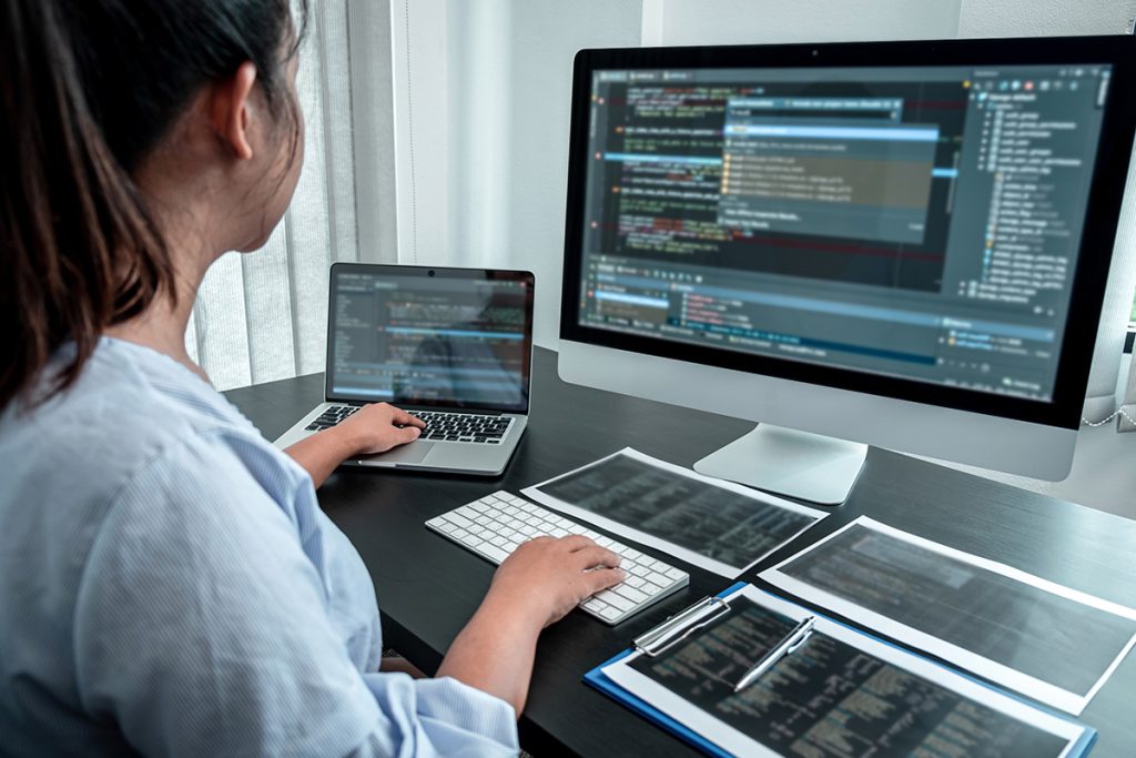 Woman working on creative web design at workstation